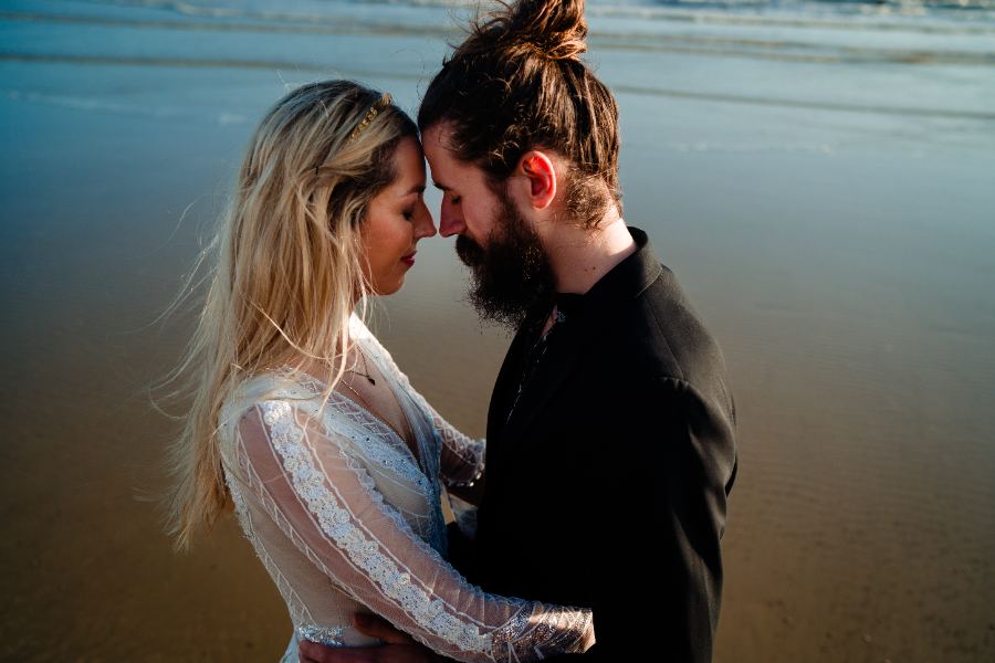 Couple forehead to forehead on the beach
